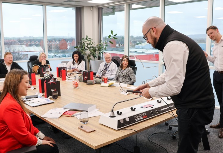 Guests around a table playing with buzz wire 